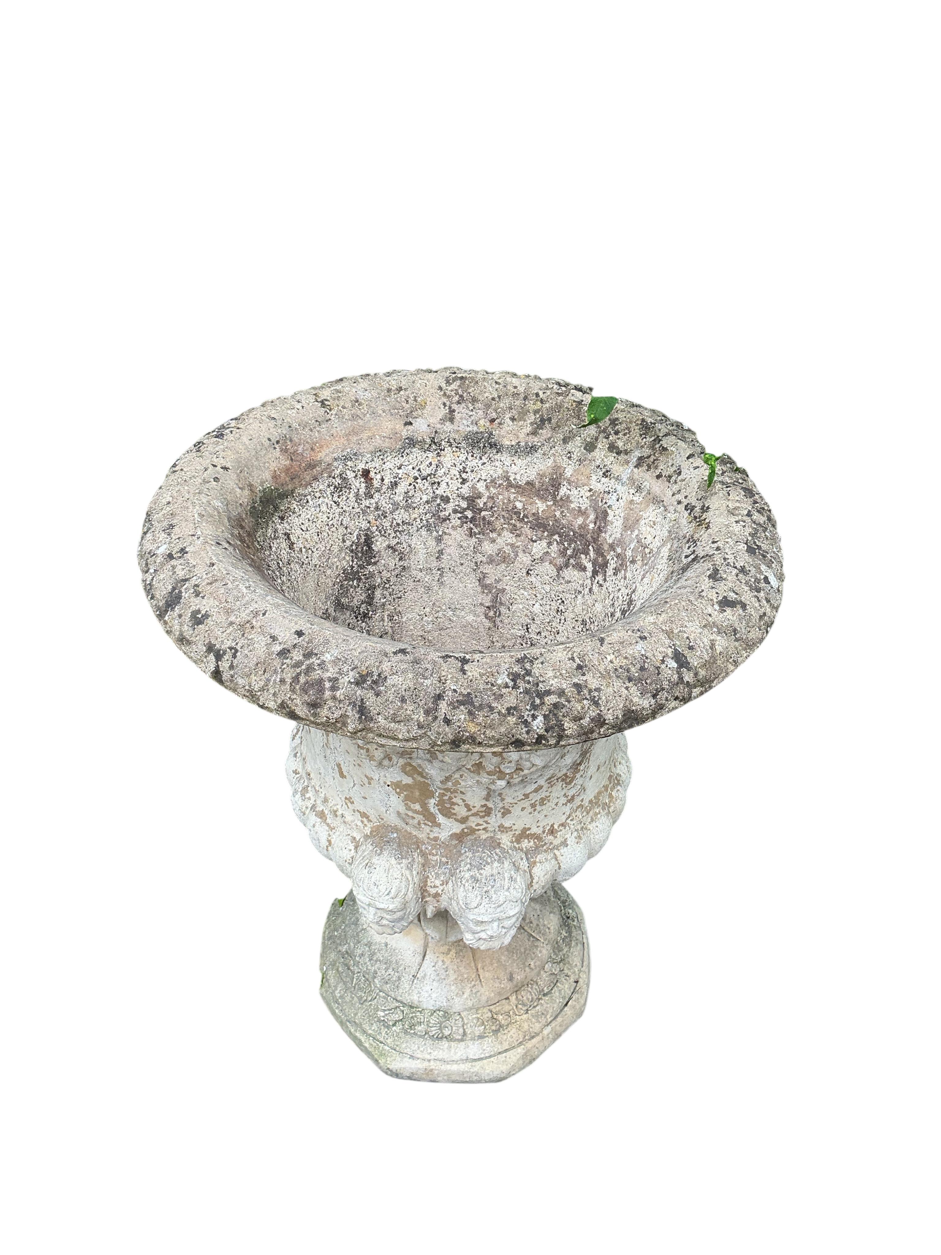 A pair of reconstituted stone campana garden urns, diameter 55cm, height 66cm